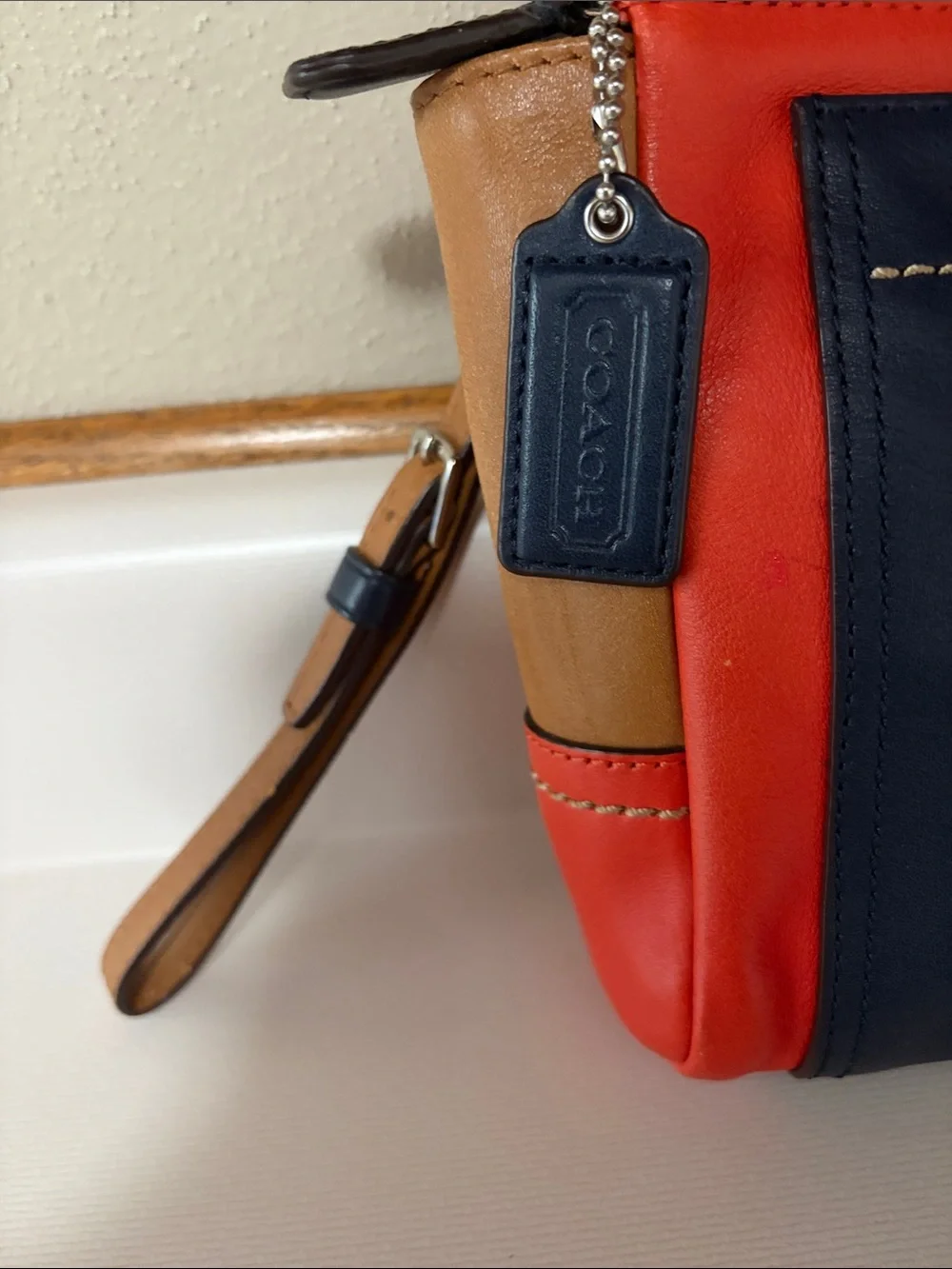 Coach Colorblock Leather Wristlet in Navy, Coral & Tan